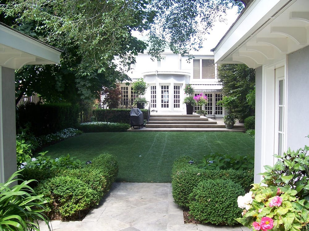 immaculate backyard with formal gardens