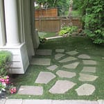 fake grass side yard with flagstone in Oakville ON
