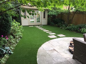 Flagstone path adds natural look around artificial grass