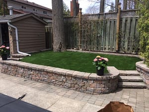 lovely small back with raised level and mature trees